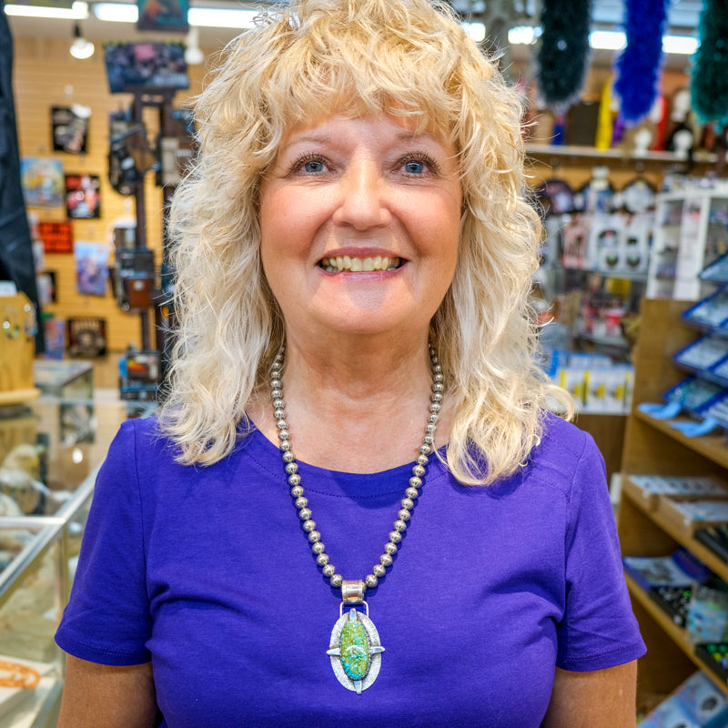 Susan Wearing Kingman Turquoise Compass Pendant