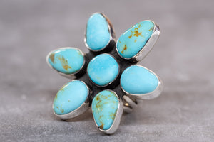 Campitos Turquoise Flower Ring by Skylar Glandon on Gray Background