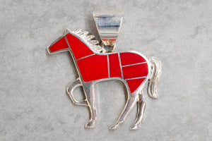 David Rosales rosarite horse pendant on a gray background