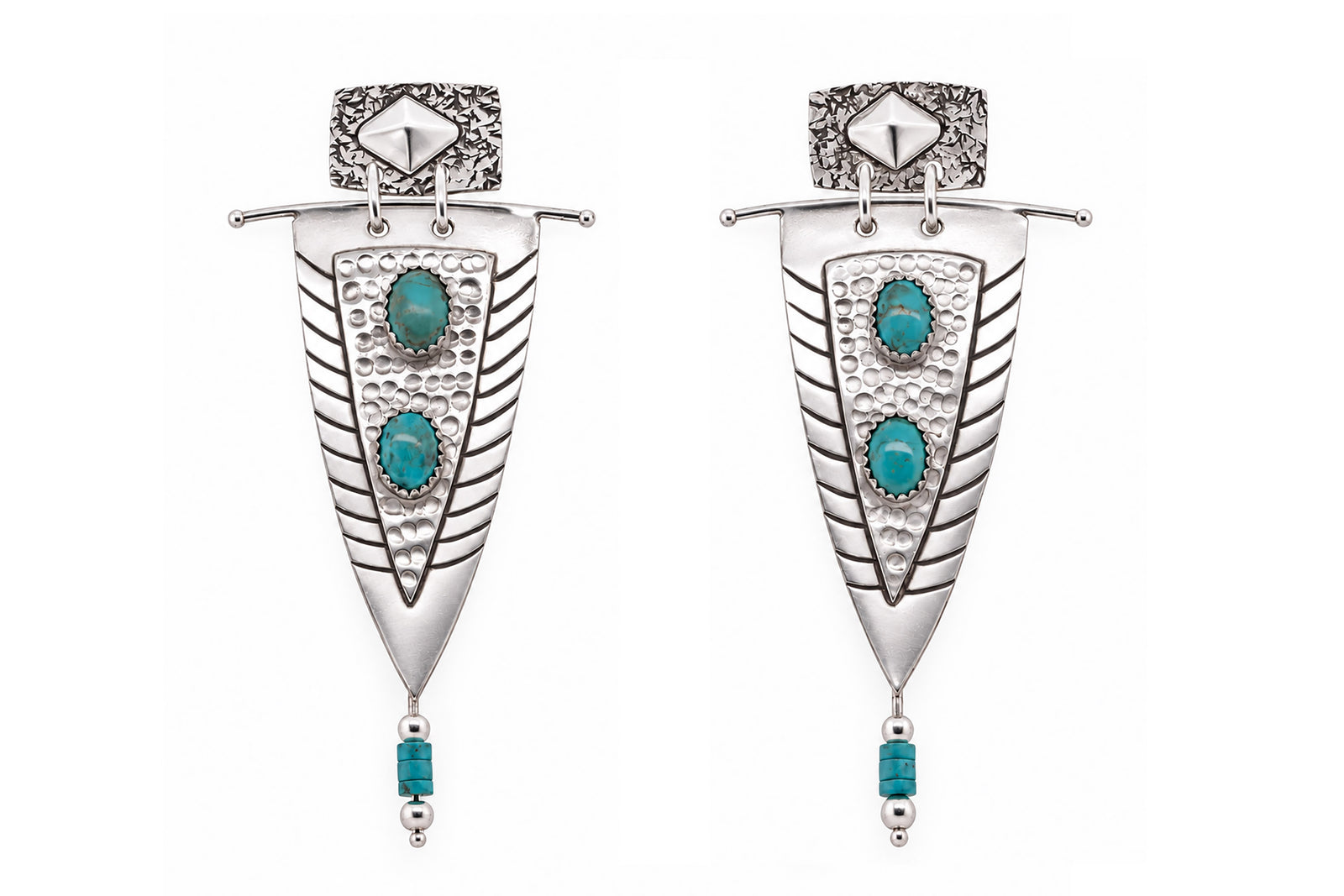 A pair of silver-toned Southwestern-style dangle earrings featuring turquoise stone accents, shown against a plain white background.