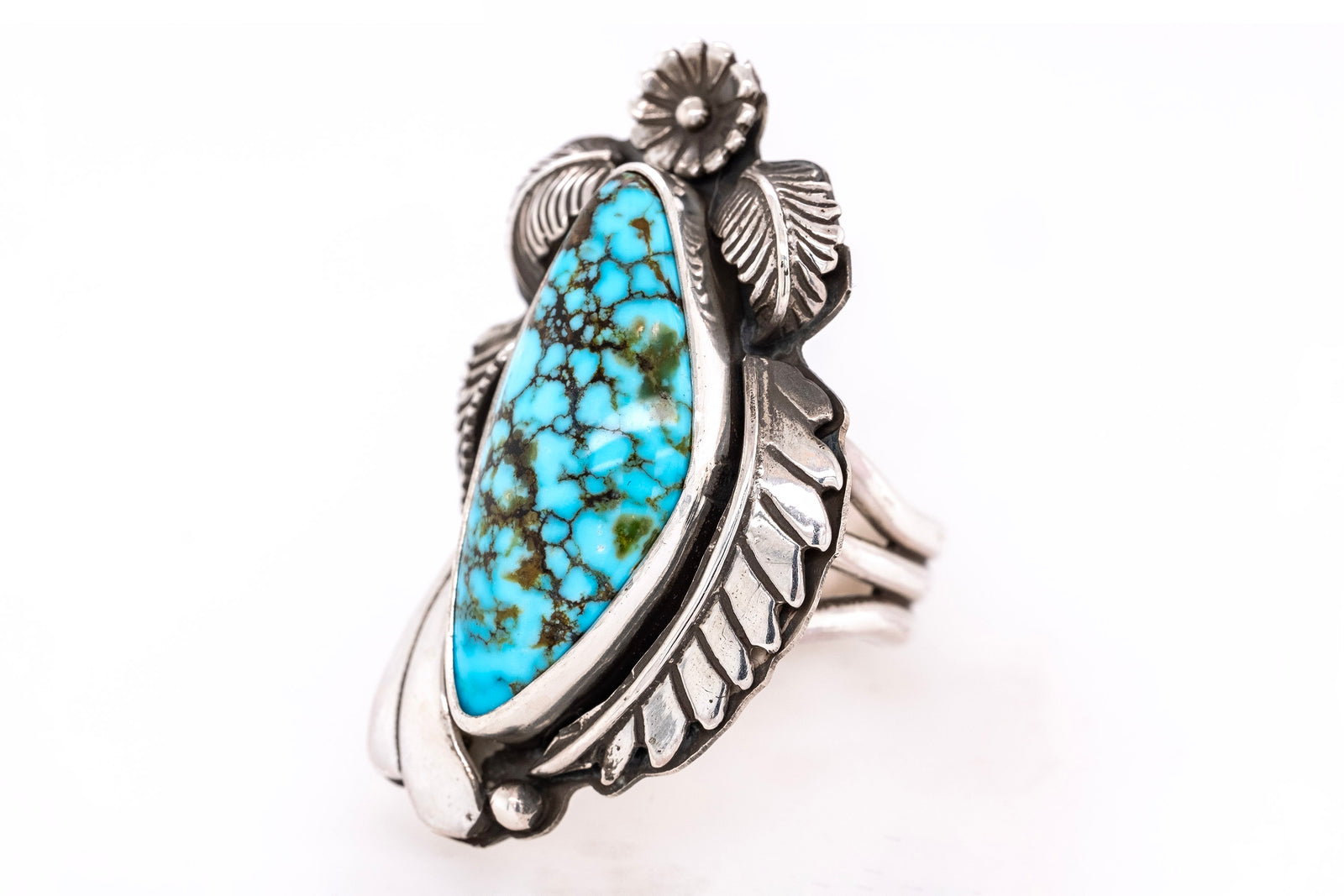 Handmade sterling silver ring with Kingman Turquoise stone, silver flower and leaf design by Gary Glandon