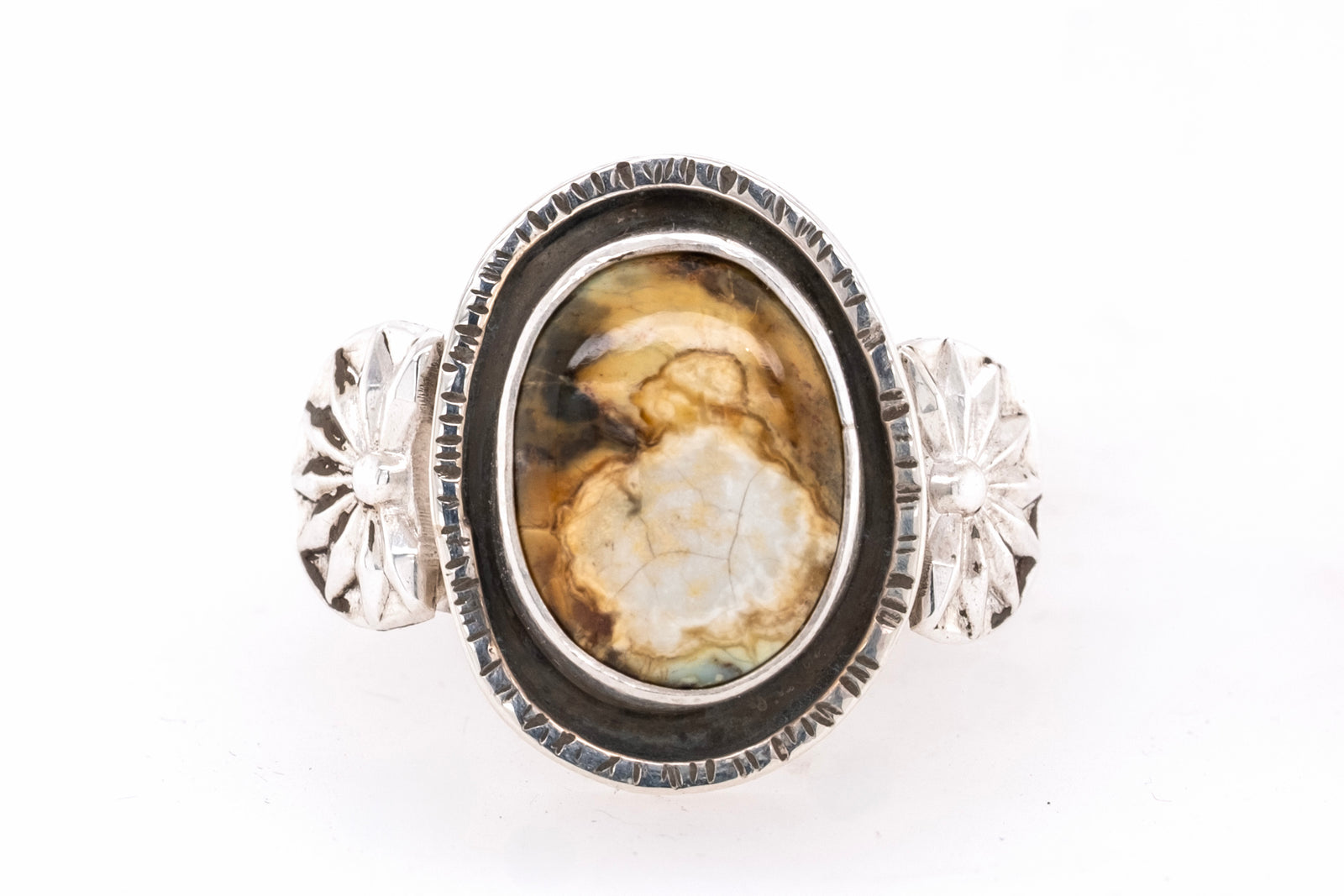 Silver ring with a New Lander stone on a white background