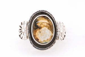 Silver New Lander ring with sunbursts on each side