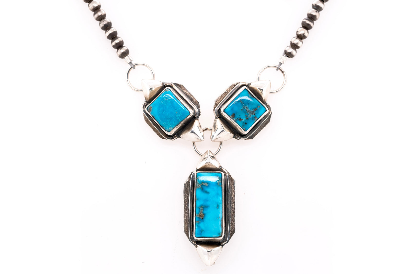 Handmade Sierra Nevada turquoise necklace with three stones, Navajo Pearls, and silver accents by Gary Glandon
