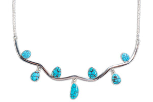 Necklace with turquoise stones on a white background
